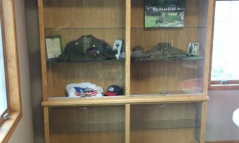 Sy Lonneman Family donates display  case to  Argonne Post 32 in his memory